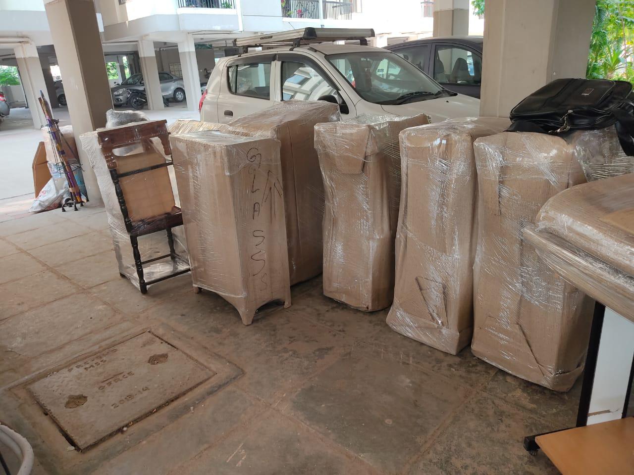 Professionally wrapped furniture and glass items packed for a move